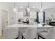 Stylish kitchen island with pendant lighting, quartz countertops, and seating for three at 2980 Ferrington Way, Smyrna, GA 30080