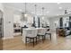 Well-lit kitchen featuring a large island, stainless steel appliances, and a view of the living area at 2980 Ferrington Way, Smyrna, GA 30080