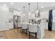 Modern kitchen with stainless steel appliances, white cabinets, and a large island with seating at 2980 Ferrington Way, Smyrna, GA 30080