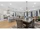 Open concept living room with a dining area, hardwood floors, and plenty of natural light at 2980 Ferrington Way, Smyrna, GA 30080