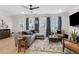Spacious living room featuring modern furniture, large windows, and a ceiling fan for added comfort at 2980 Ferrington Way, Smyrna, GA 30080