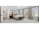 Bright and airy bedroom with large windows, neutral tones, and an ensuite bathroom entrance at 2980 Ferrington Way, Smyrna, GA 30080