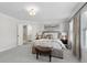 An elegant main bedroom featuring neutral tones, carpet, and ensuite bathroom at 2980 Ferrington Way, Smyrna, GA 30080
