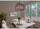 Bright dining room features a modern chandelier and a view of the outdoors at 3007 Holly St, Canton, GA 30115