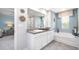 Spacious bathroom featuring double sinks, tub, and stylish decorative accents at 221 Friendship Oak Way, Hampton, GA 30228