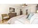 Bedroom showcasing natural light, wood furnishings, and a stylish woven blanket at 221 Friendship Oak Way, Hampton, GA 30228