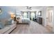 Spacious main bedroom with large windows, a ceiling fan, stylish decor and an ensuite bathroom at 221 Friendship Oak Way, Hampton, GA 30228
