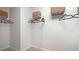 Walk-in closet with shelving, hanging rods, and ample storage space at 221 Friendship Oak Way, Hampton, GA 30228