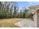 Exterior view of a backyard with a patio and mature trees at 2328 Starline Dr, Decatur, GA 30032