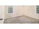 Neutral bedroom with light brown carpet, bright natural light and painted neutral walls at 2328 Starline Dr, Decatur, GA 30032