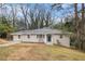 Charming brick ranch-style home with a well-manicured lawn and inviting front entrance at 2328 Starline Dr, Decatur, GA 30032