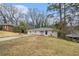 A quaint ranch home featuring a well-kept lawn and a welcoming front facade at 2328 Starline Dr, Decatur, GA 30032
