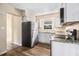 Well-lit kitchen featuring white cabinets, stainless steel appliances, and granite countertops at 2328 Starline Dr, Decatur, GA 30032