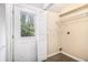 Laundry room with a door to the outside and a wire rack at 2328 Starline Dr, Decatur, GA 30032