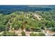 An aerial view of wooded homesite surrounded by mature trees at 1491 S Hairston Rd, Stone Mountain, GA 30088