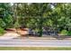 A fixer upper home with mature trees and large frontage road access at 1491 S Hairston Rd, Stone Mountain, GA 30088