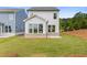 Backyard featuring a well-manicured lawn and view of home's exterior at 1985 William Glen St, Dacula, GA 30019