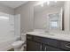 Bathroom featuring a vanity with modern fixtures and a shower/tub combo at 1985 William Glen St, Dacula, GA 30019