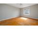Bedroom featuring a ceiling fan, a large window, and wood parquet floors at 3535 Roswell Ne Rd # H2, Atlanta, GA 30305