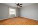 Bedroom featuring a ceiling fan, a large window, and wood parquet floors at 3535 Roswell Ne Rd # H2, Atlanta, GA 30305