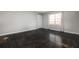 Bright living room featuring a large window and wood parquet floors at 3535 Roswell Ne Rd # H2, Atlanta, GA 30305