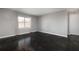 Bright living room featuring a large window and wood parquet floors at 3535 Roswell Ne Rd # H2, Atlanta, GA 30305