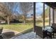 Inviting back patio featuring ample seating and a picturesque view of the lush green backyard at 461 Wynns Way, Atlanta, GA 30331