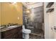 Compact bathroom with granite countertops, tiled shower, and modern fixtures at 461 Wynns Way, Atlanta, GA 30331