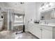 Stylish bathroom featuring a walk-in shower, tub, and vanity with ample storage at 461 Wynns Way, Atlanta, GA 30331