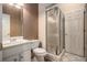 Compact bathroom features a tiled shower, updated vanity, and tile flooring at 461 Wynns Way, Atlanta, GA 30331