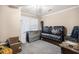 Bedroom featuring a black leather bed set, neutral walls, and a window with blinds at 461 Wynns Way, Atlanta, GA 30331