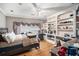 Spacious bedroom with hardwood floors, built-in shelving, and ample natural light from the window at 461 Wynns Way, Atlanta, GA 30331