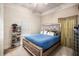 Bedroom with a blue bed, shoe rack and curtains at 461 Wynns Way, Atlanta, GA 30331