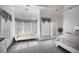 Cozy bedroom featuring large windows, sitting area, and a comfortable bed at 461 Wynns Way, Atlanta, GA 30331