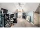 Lofted bonus room featuring high ceilings, a ceiling fan, and natural light from a window at 461 Wynns Way, Atlanta, GA 30331