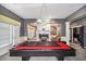 Bonus room with a billiard table, fireplace, neutral walls, and abundant natural light from the windows at 461 Wynns Way, Atlanta, GA 30331