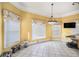 Bright breakfast nook with large windows, tile floors, and space for casual dining at 461 Wynns Way, Atlanta, GA 30331