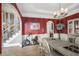 Traditional dining room featuring hardwood floors, decorative chandelier and staircase access at 461 Wynns Way, Atlanta, GA 30331