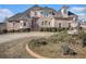 Elegant brick home with manicured landscaping, stately fountain, and a circular driveway at 461 Wynns Way, Atlanta, GA 30331