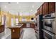 Well-appointed kitchen with stainless steel appliances, granite countertops, and tile flooring at 461 Wynns Way, Atlanta, GA 30331