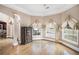 Living area with hardwood floors, bay windows, and built in cabinet at 461 Wynns Way, Atlanta, GA 30331