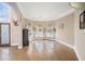 Bright living area with hardwood floors, large windows, and decorative window treatments at 461 Wynns Way, Atlanta, GA 30331