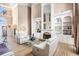Open-concept living area featuring hardwood floors, a fireplace, and lots of natural light at 461 Wynns Way, Atlanta, GA 30331