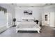 Spacious main bedroom with a double door entrance, gray carpet, and lots of natural light at 461 Wynns Way, Atlanta, GA 30331
