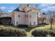 Stunning rear exterior showcasing a well-maintained yard, deck, and multi-story house at 461 Wynns Way, Atlanta, GA 30331