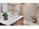 Modern bathroom with quartz countertop, updated fixtures, and a walk-in shower at 615 Spruce Dr, Pine Lake, GA 30072