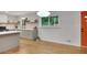 Open-concept kitchen features modern cabinets, quartz countertops, and stainless steel appliances at 615 Spruce Dr, Pine Lake, GA 30072
