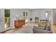 Stylish living room features hardwood floors, modern furniture, and access to an outdoor deck at 615 Spruce Dr, Pine Lake, GA 30072