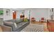 Bright living room with modern furniture, hardwood floors, and a view of the front door at 615 Spruce Dr, Pine Lake, GA 30072