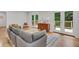 Cozy living room with hardwood floors, modern furniture, and access to an outdoor deck at 615 Spruce Dr, Pine Lake, GA 30072